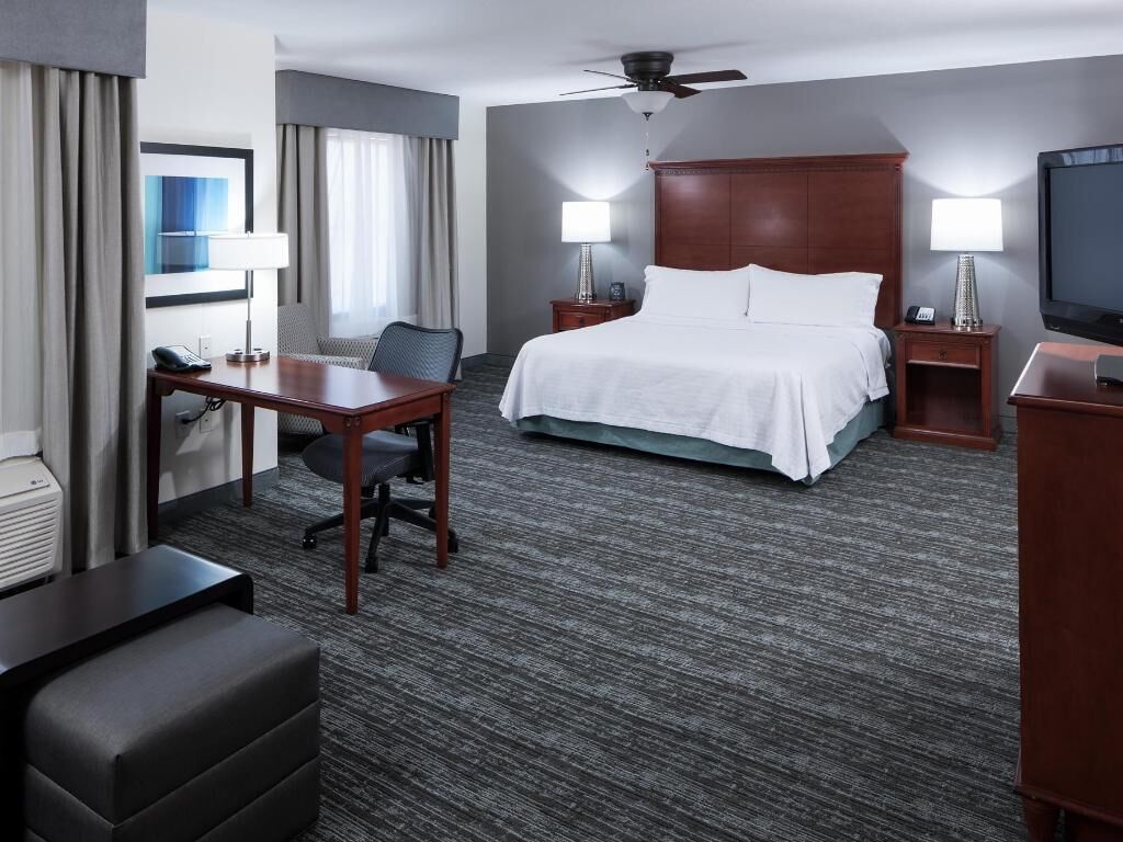Premium bedding, pillowtop beds, laptop workspace, blackout drapes