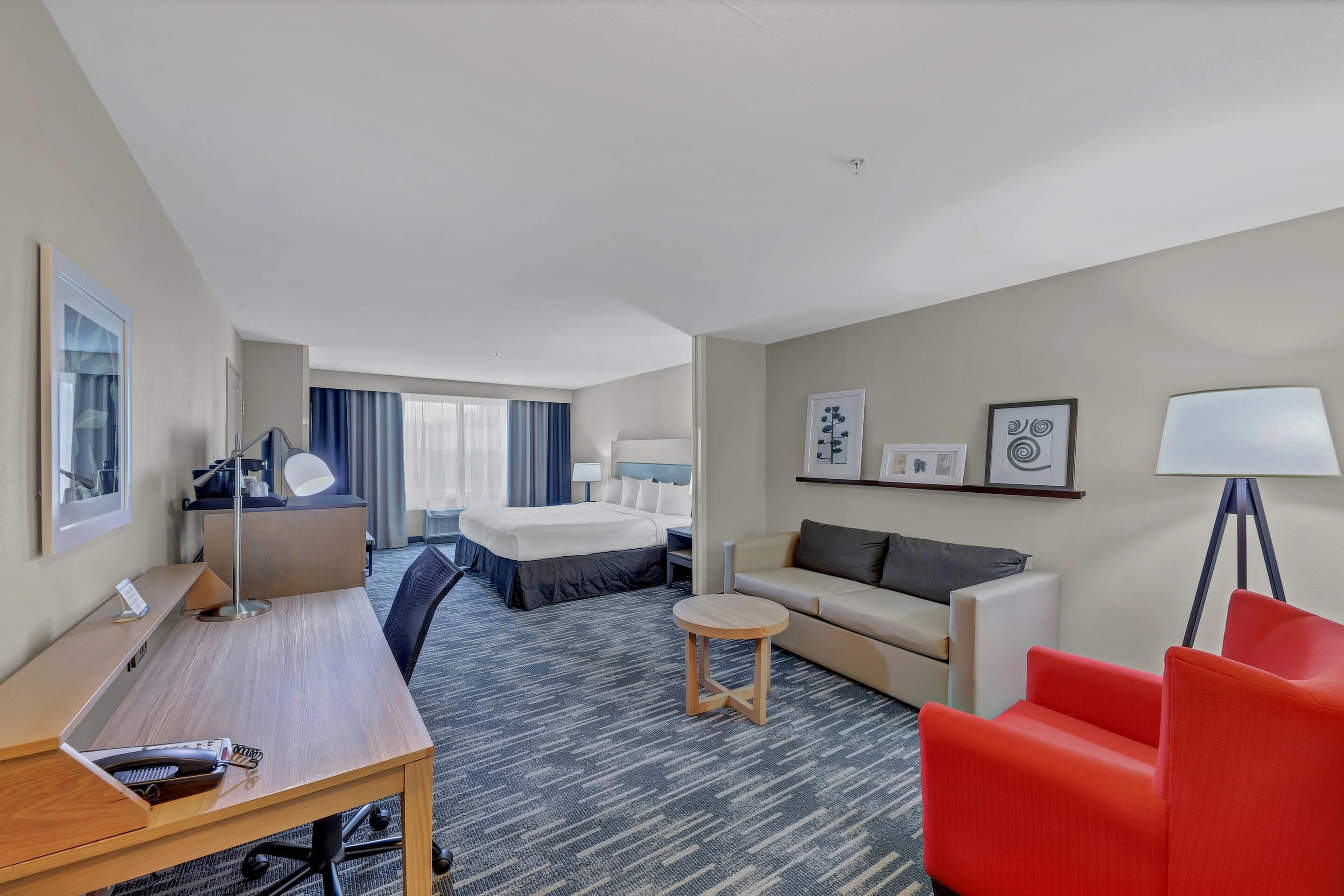 Studio Suite, 1 King Bed with Sofa bed, Non Smoking | Desk, laptop workspace, blackout drapes, iron/ironing board