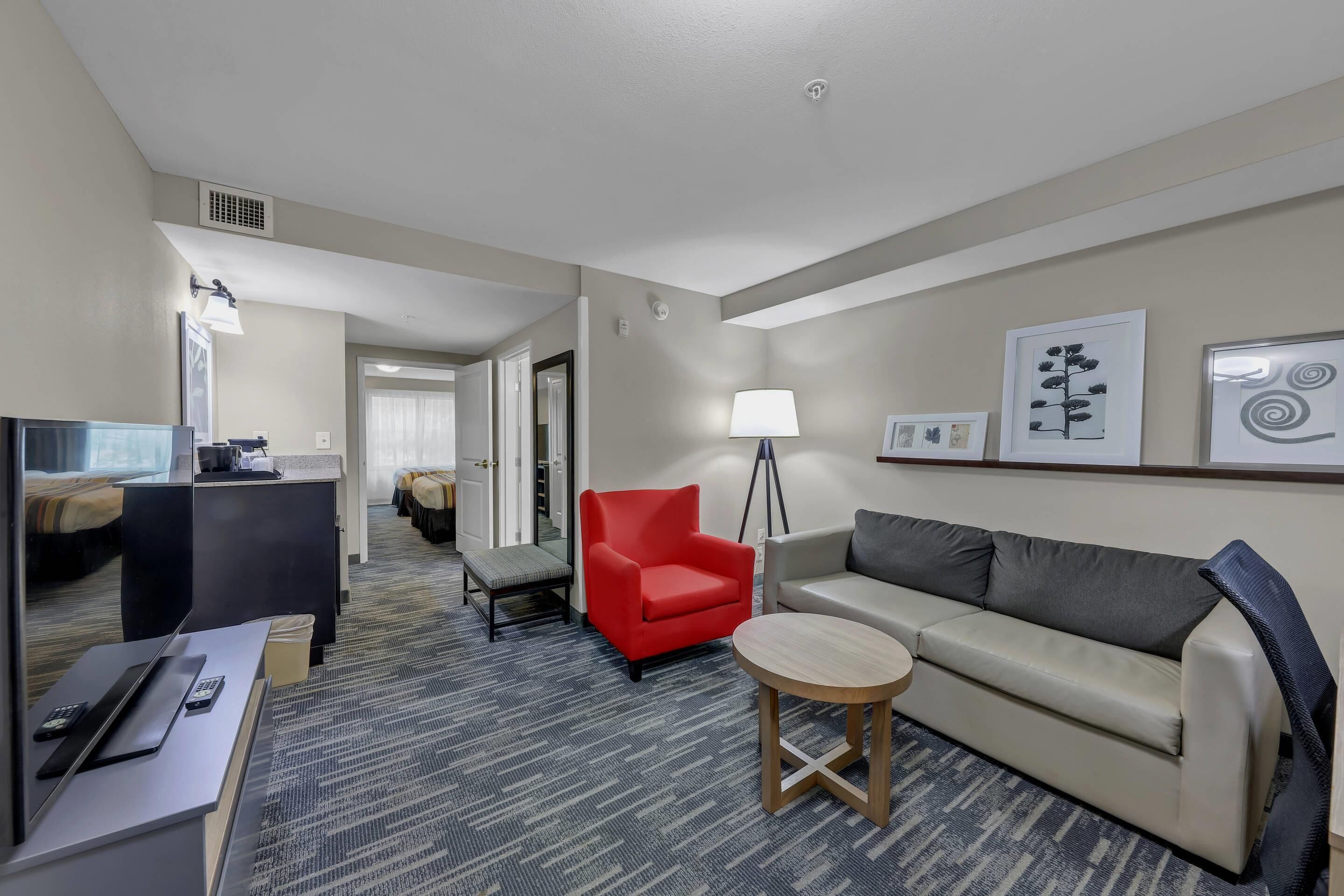 Suite, 1 Bedroom, Non Smoking (Two Queen Beds and Sofa Bed) | Desk, laptop workspace, blackout drapes, iron/ironing board