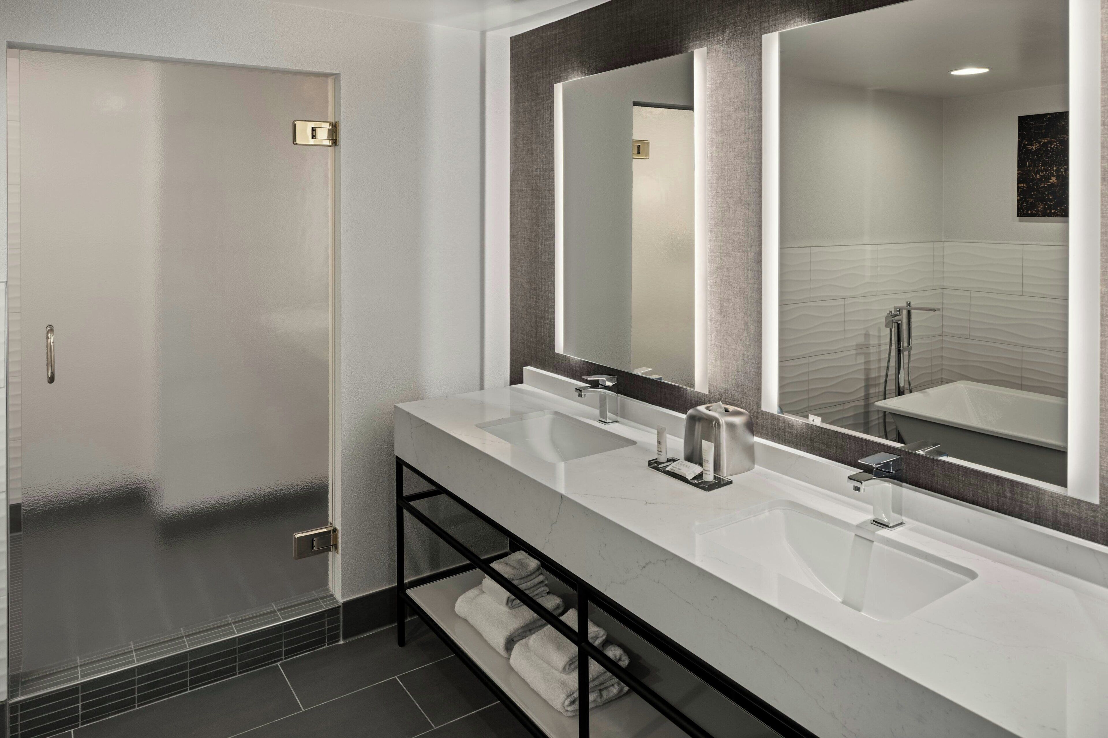 combined shower/bathtub, designer toiletries, hair dryer, towels