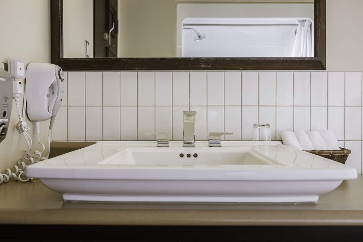 comfort room 2 queen beds at the caribou pavilion  | bathroom | hair dryer, towels, soap, shampoo