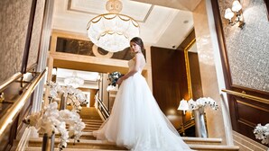 A grand staircase with ornate railings and a chandelier. - InterContinental Kyiv by IHG (Kyiv)
