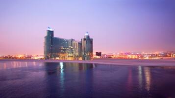 Standing proudly by the water, this hotel showcases its unique, curved design.