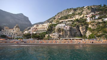 Private beach, black sand, sun-loungers, beach umbrellas