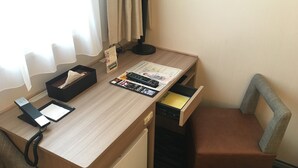 A hotel desk with a computer, a telephone, a tissue box, a magazine, and a drawer. - Smile Hotel Tokyo Asagaya (Tokyo)