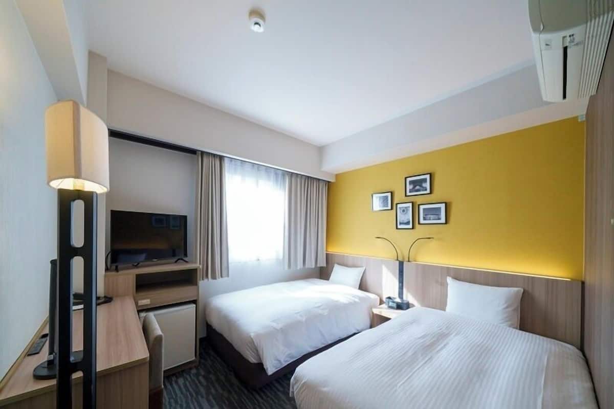 Standard Twin Room | Desk, blackout drapes, iron/ironing board, free WiFi