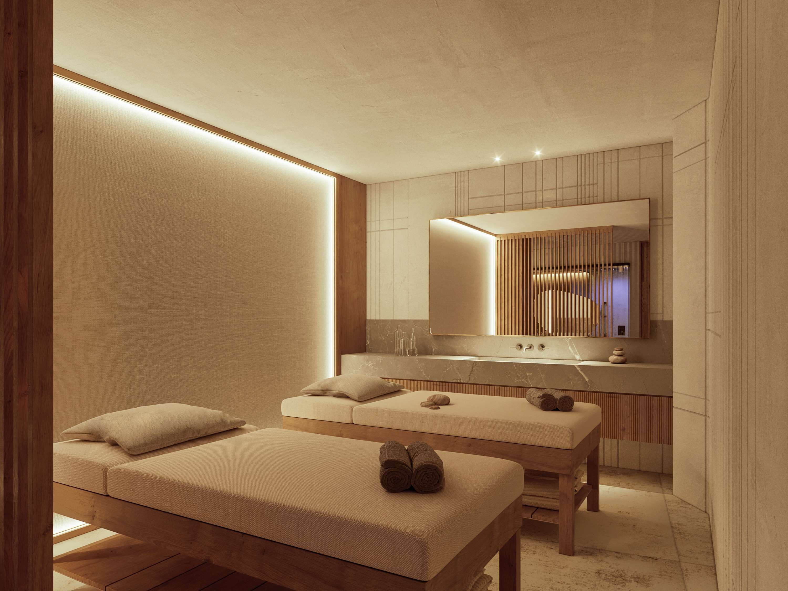 A modern spa room with a wooden bench, a massage table, and a large mirror above a vanity.