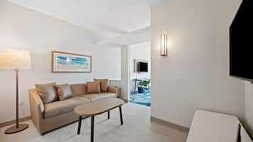 Suite, 1 King Bed | Living area | 55-inch flat-screen TV with digital channels, TV