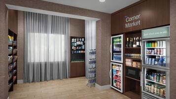 Una tienda de barrio con estantes llenos de aperitivos, bebidas y artículos para el hogar.