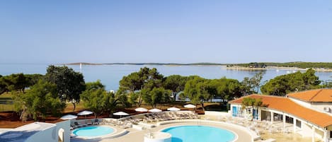 Indoor pool, 2 outdoor pools, open 8 AM to 9 PM, pool umbrellas