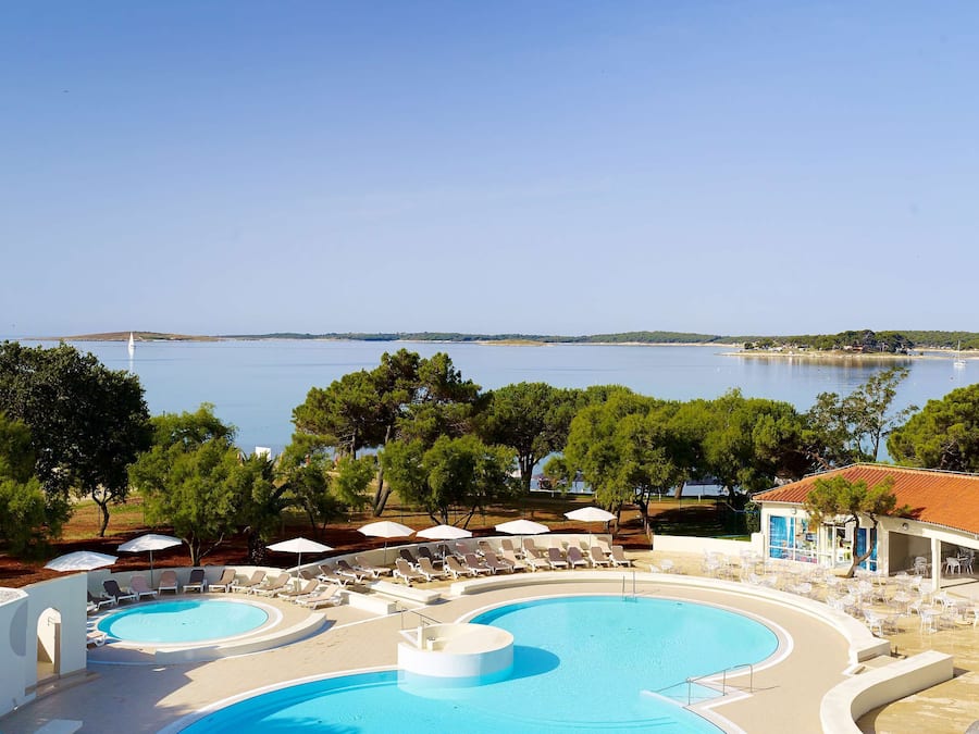 Indoor pool, 2 outdoor pools, open 8 AM to 9 PM, pool umbrellas