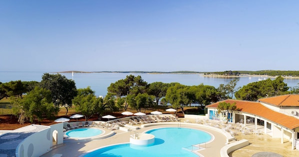 Indoor pool, 2 outdoor pools, open 8 AM to 9 PM, pool umbrellas