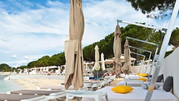 On the beach, beach cabanas, sun-loungers, beach umbrellas