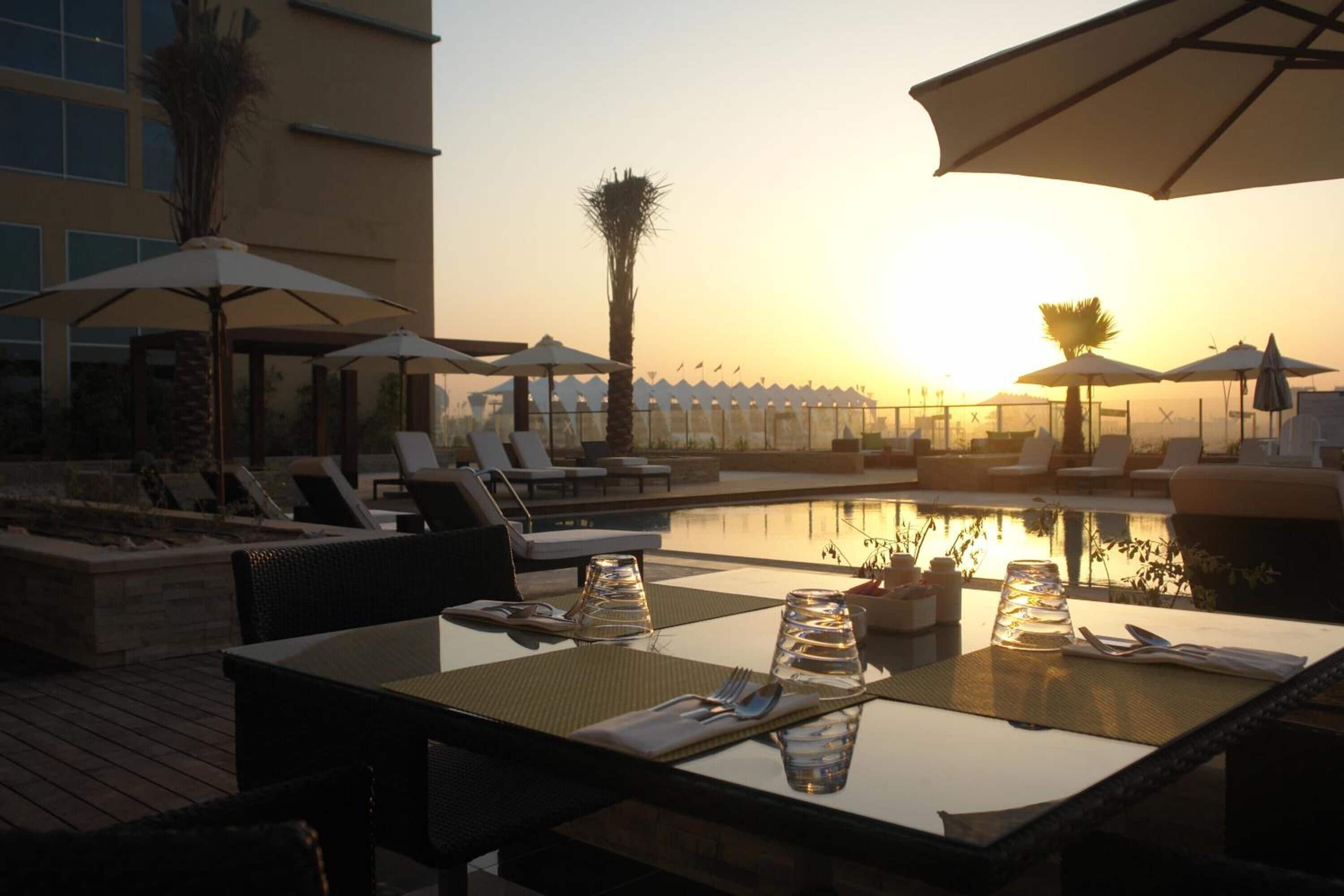 Breakfast, lunch, dinner served; international cuisine, pool views 