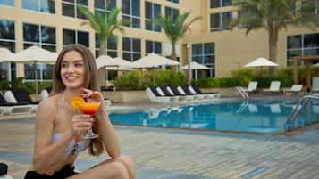 Outdoor pool, pool umbrellas, pool loungers