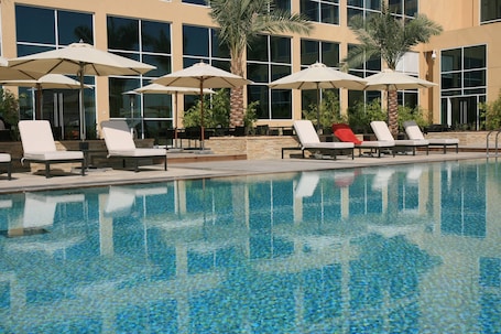 Outdoor pool, pool umbrellas, sun loungers
