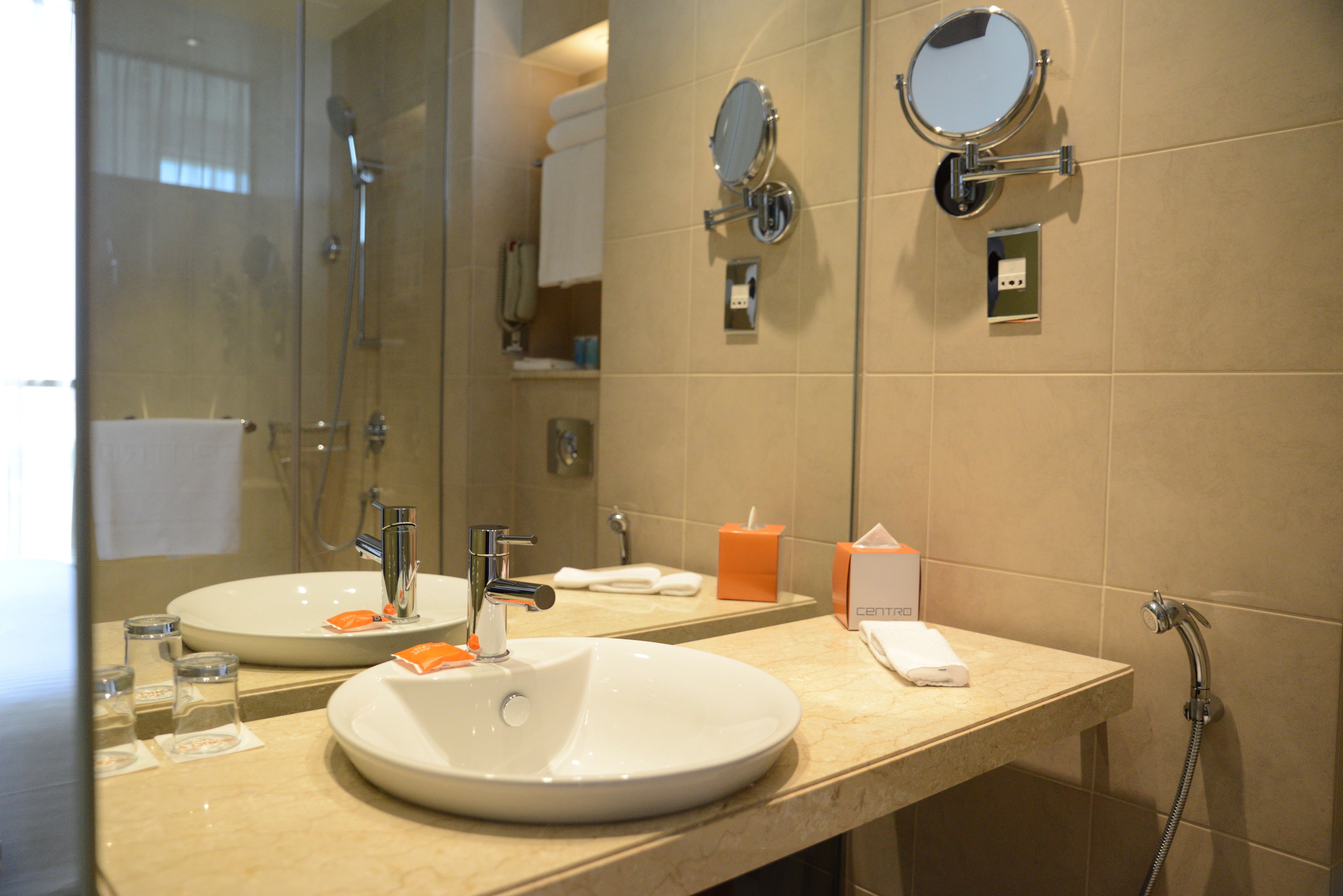 centro room pool view queen bed | bathroom | shower, eco-friendly toiletries, hair dryer, bathrobes