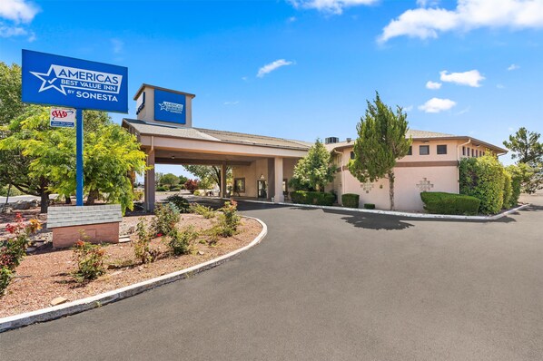A hotel entrance with a sign indicating it is the Americas Best Value Inn by Sonesta. - Americas Best Value Inn Prescott Valley (Prescott Valley)