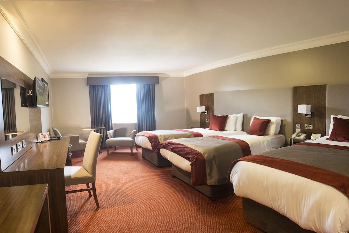 deluxe triple room | in-room safe, desk, soundproofing, iron/ironing board