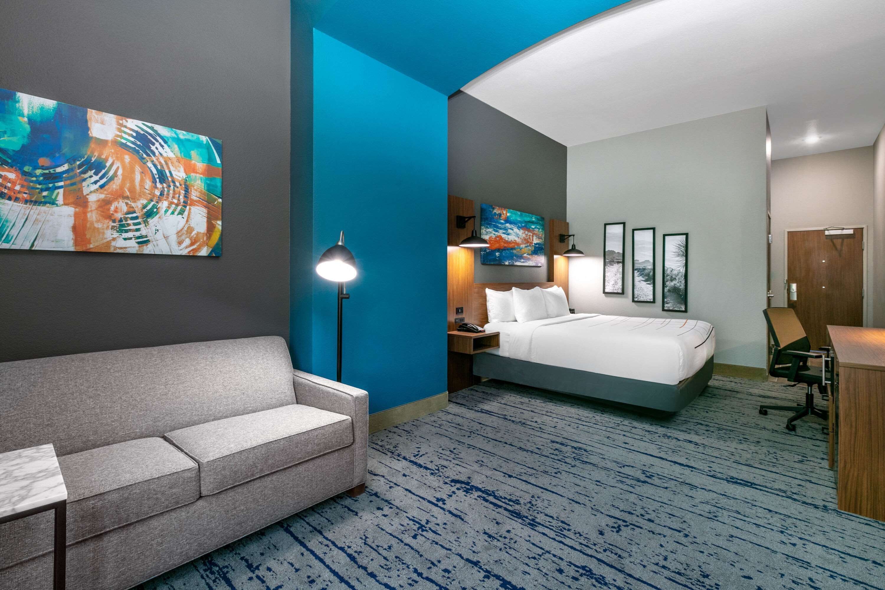 deluxe room, 1 king bed, non smoking | premium bedding, desk, iron/ironing board, free wifi