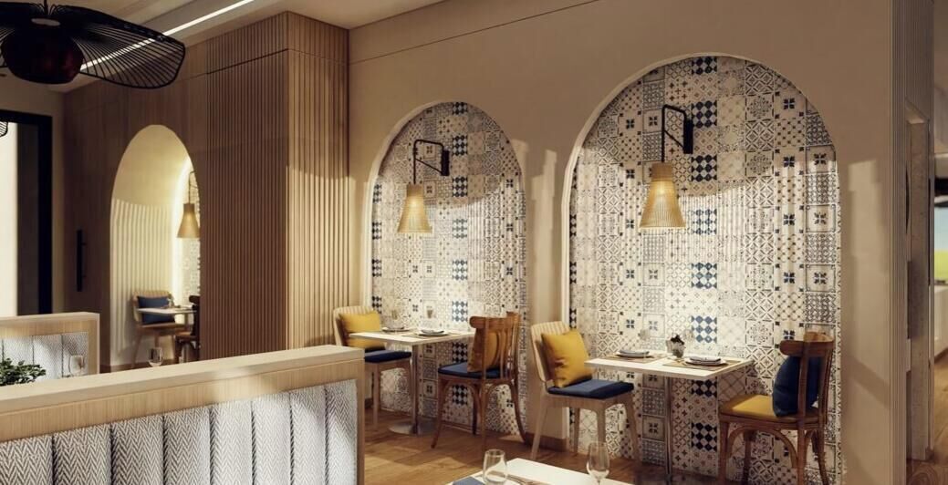 A restaurant with a wooden interior, arched windows, and patterned tile walls.