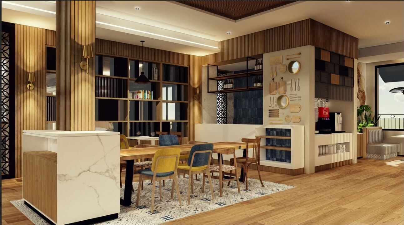 A modern living room with a dining area, wooden paneling, built-in bookshelves, and a large window.