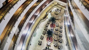 A multi-level atrium with a central open space featuring a decorative fountain and seating areas. - Khalidiya Palace Rayhaan by Rotana (Abu Dhabi)