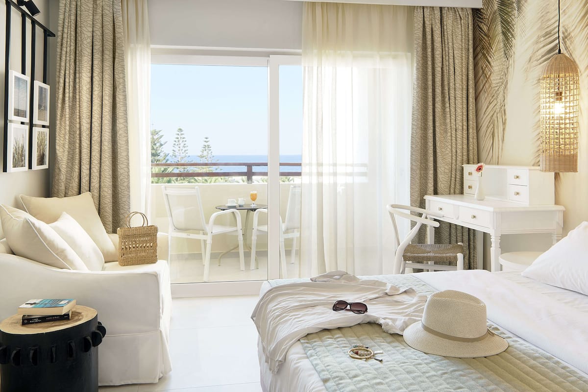 standard room, sea view | minibar, in-room safe, individually decorated, individually furnished