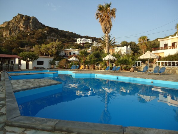 Outdoor pool, open 8:00 AM to 8:00 PM, sun loungers