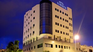 A multi-story hotel with a prominent sign reading "HOTEL EL YACOUTA." - Hôtel El Yacouta (Tetouan)