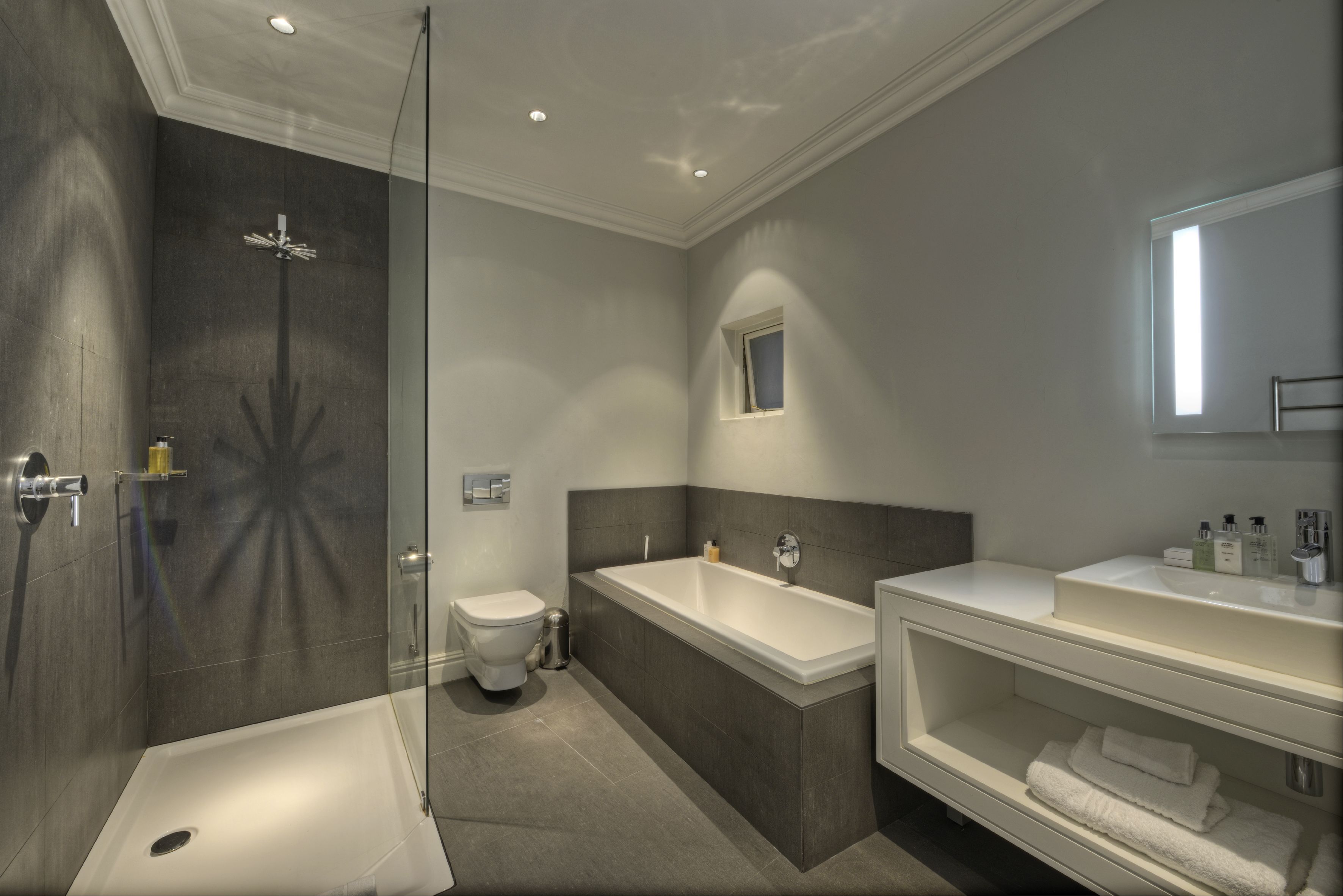 luxury room | bathroom | rainfall showerhead, hair dryer, bathrobes, slippers