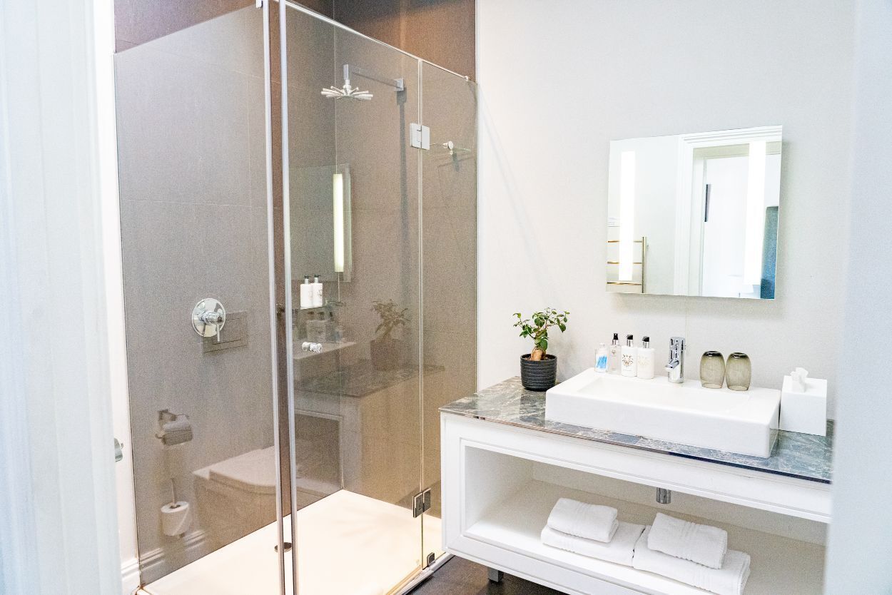 luxury room, patio | bathroom | rainfall showerhead, hair dryer, bathrobes, slippers