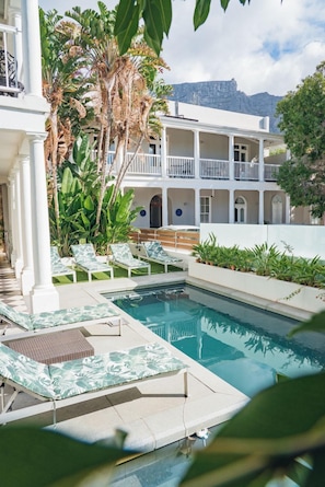 Outdoor pool, pool loungers - The Three Boutique Hotel (Cape Town)
