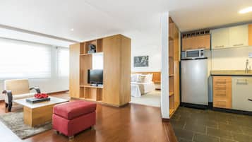 Apartment, 1 Bedroom | Living area | Flat-screen TV