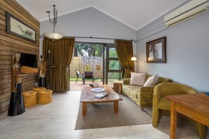 Luxury Apartment | Living area | 32-inch flat-screen TV with satellite channels, TV