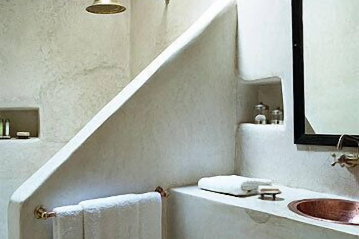 designer toiletries, hair dryer, towels