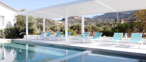 Outdoor pool, open 8:00 AM to 8:00 PM, sun loungers