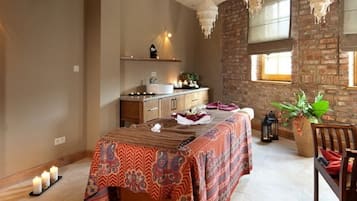Enjoy meals in this beautifully appointed dining area with a long table, brick wall, and large window.