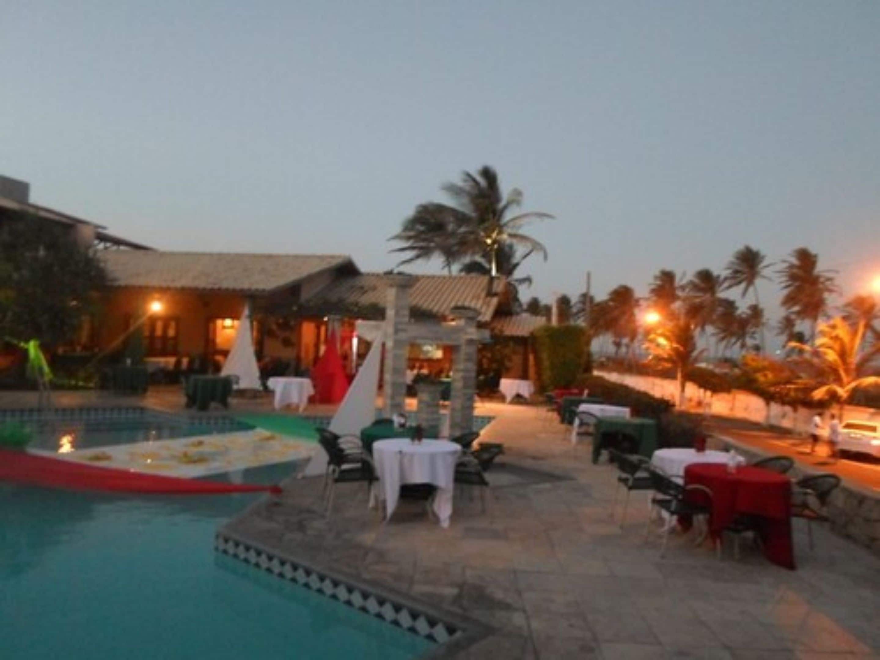 outdoor pool, open 8:00 am to 8:00 pm, pool umbrellas, pool loungers