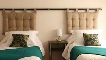 Edredón, camas con pillow-top y minibar