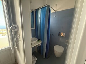 Economy Double or Twin Room | Bathroom | Shower, hair dryer, towels, soap