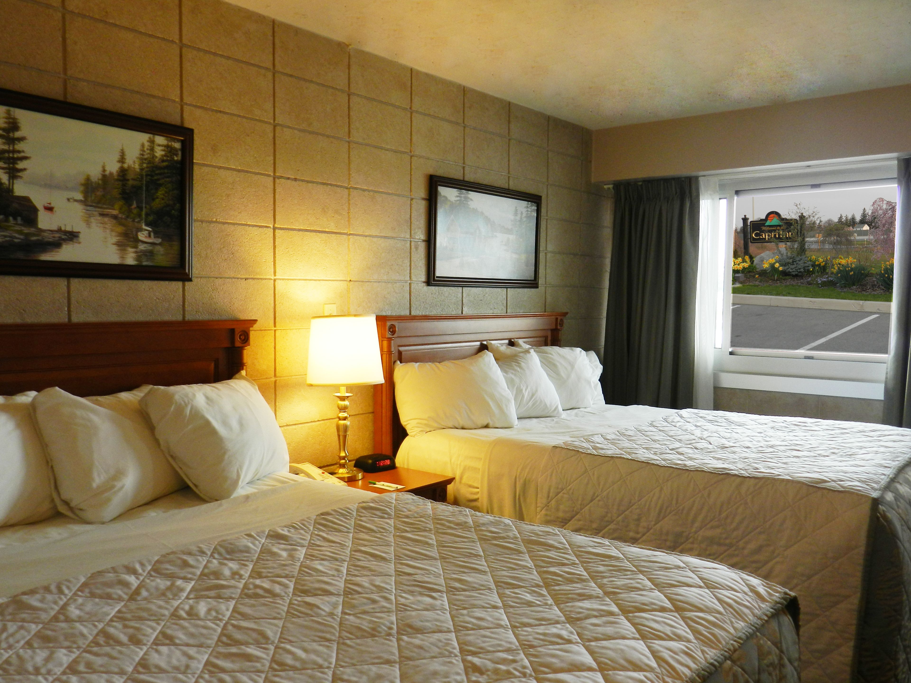 standard room, 2 queen beds, non smoking | premium bedding, pillow-top beds, in-room safe, individually decorated