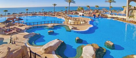 Indoor pool, outdoor pool, pool umbrellas, pool loungers