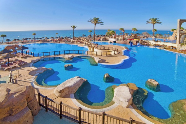 Indoor pool, outdoor pool, pool umbrellas, sun loungers