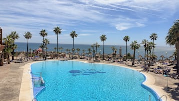 Indoor pool, outdoor pool, pool umbrellas, pool loungers