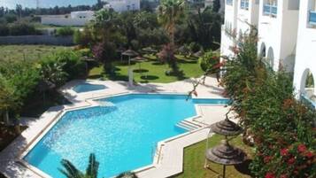 Indoor pool, seasonal outdoor pool, pool umbrellas, pool loungers