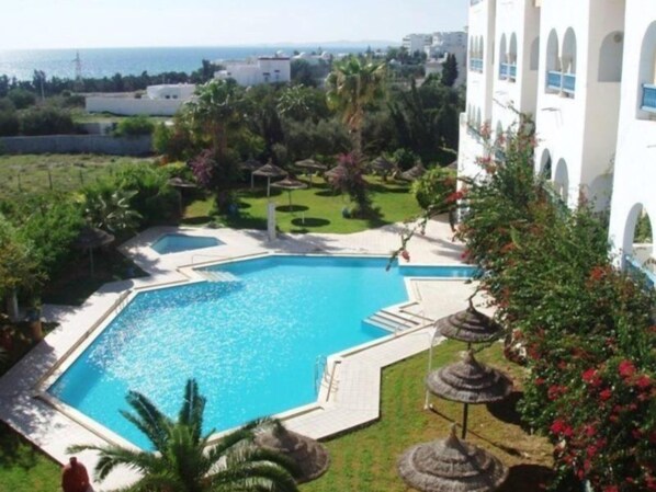 Indoor pool, outdoor pool, pool umbrellas, pool loungers