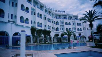 Indoor pool, seasonal outdoor pool, pool umbrellas, pool loungers