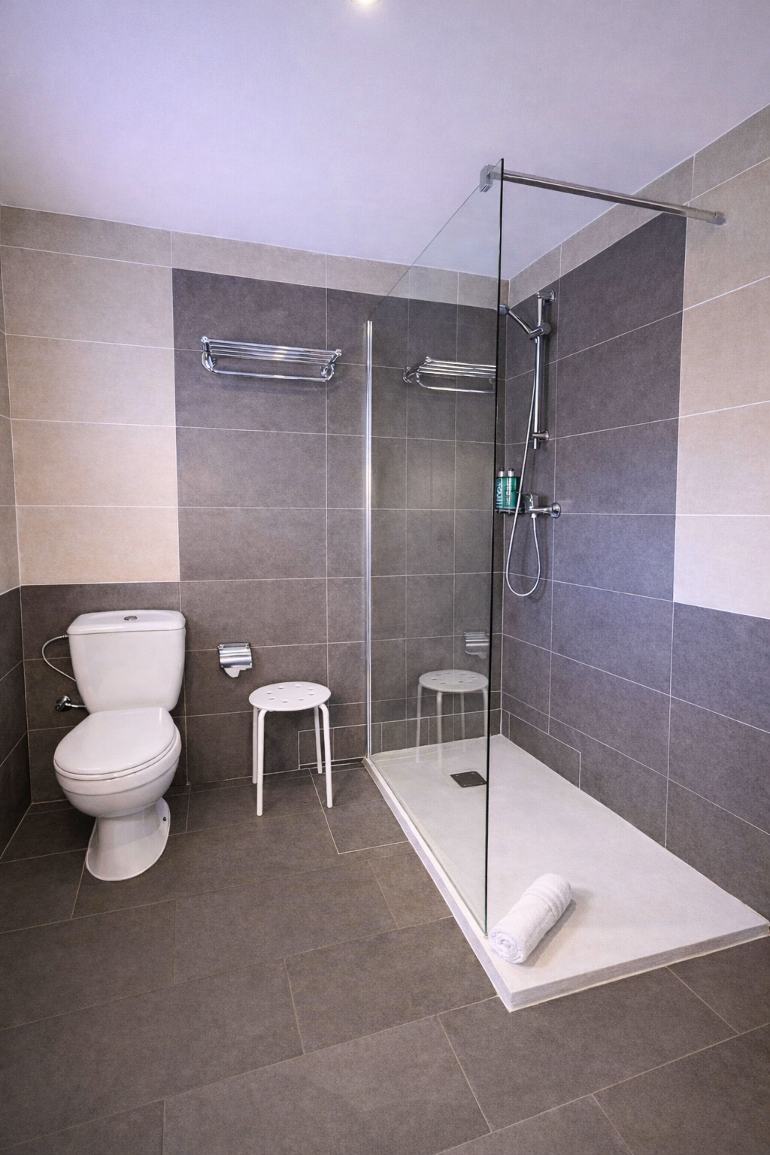 Shower, rainfall showerhead, hair dryer, towels