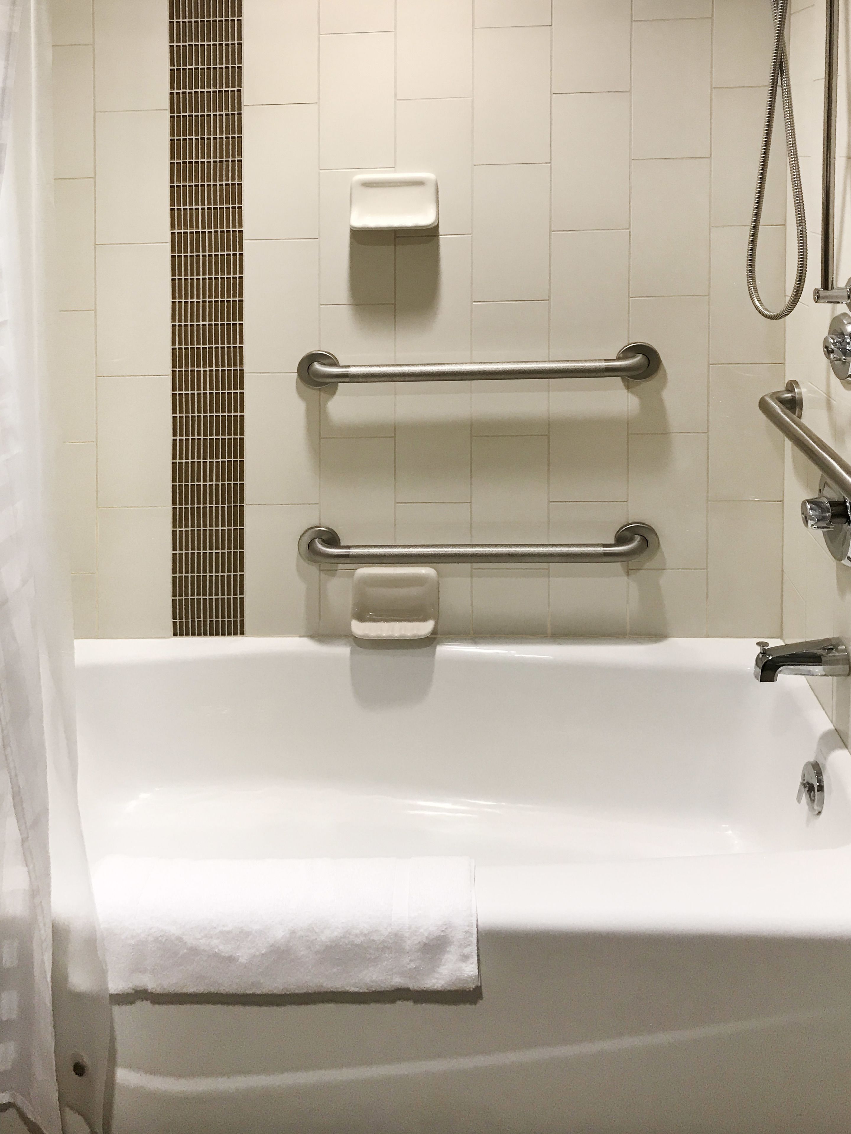 designer toiletries, hair dryer, towels